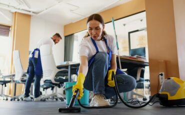 professional-cleaning-service-person-using-vacuum-cleaner-office