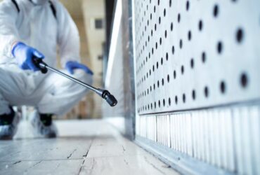 imgi_14_unrecognizable-person-white-chemical-protection-suit-doing-disinfection-public-areas-stop-spreading-highl