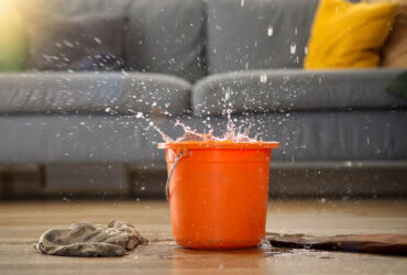 water-dripping-from-ceiling-into-bucket-on-floor-i-2026-01-09-00-50-23-utc